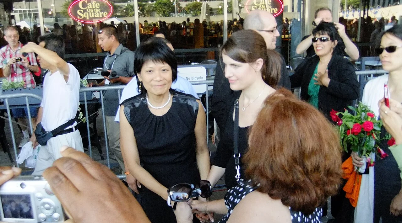 Olivia Chow and Sarah Layton standing with people gathered to remember Jack Layton at City Hall.