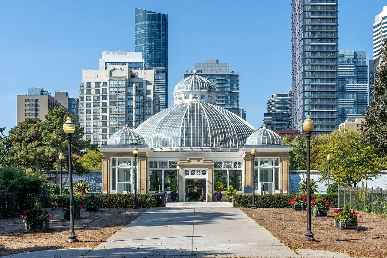 The domed glass Palm House and adjoining conservatory at Allan Gardens.