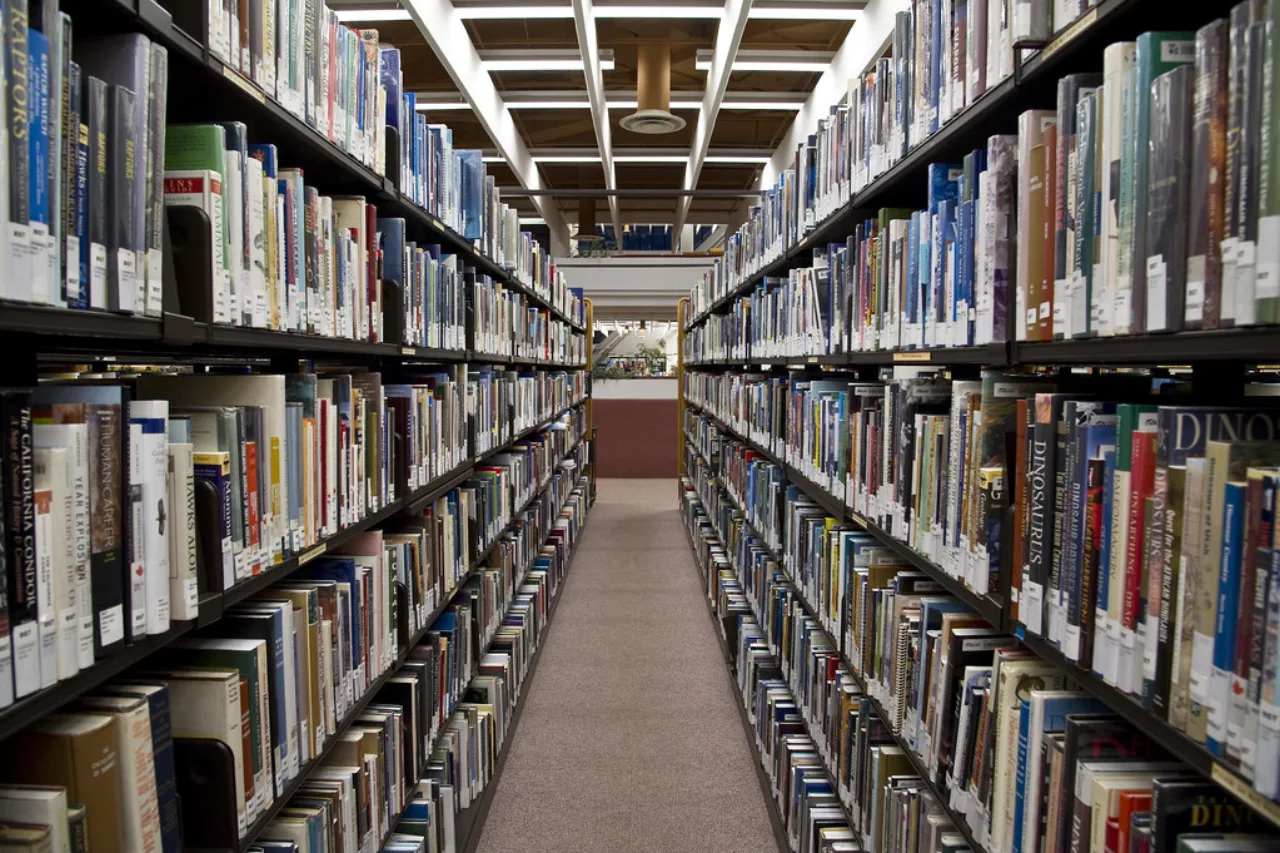 An aisle between shelves of books at Toronto Reference Library.