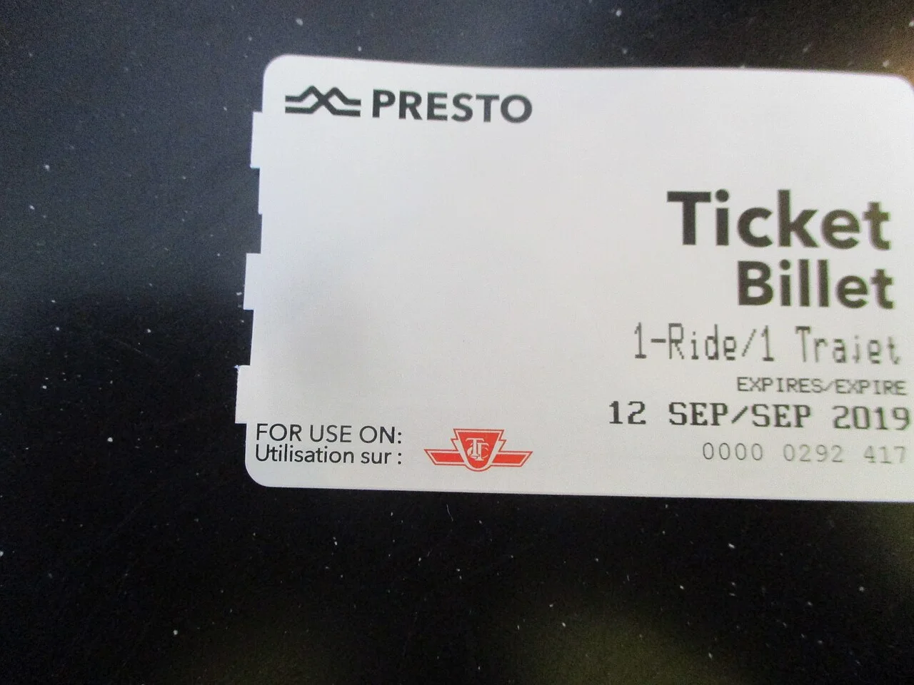 An older one-ride PRESTO Ticket bearing the TTC logo and a printed expiration date.