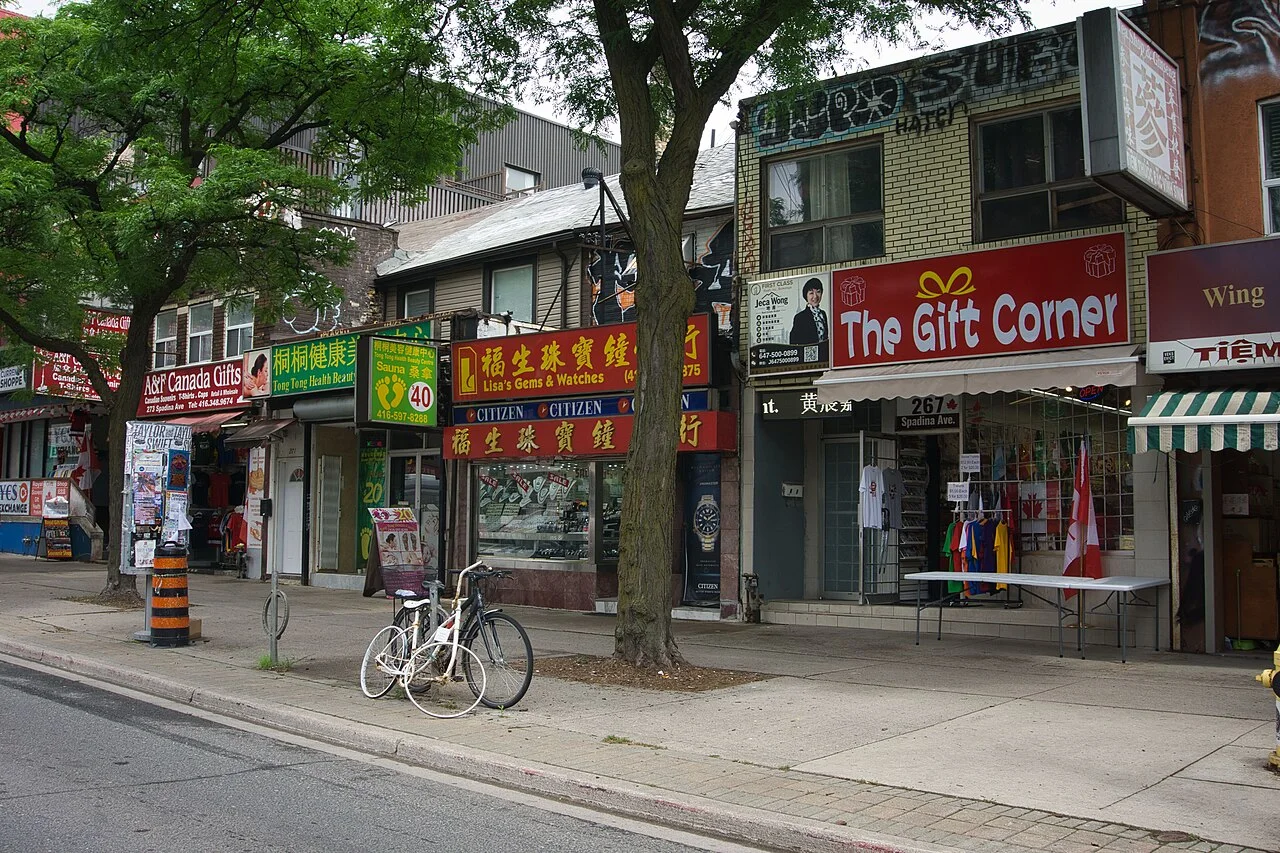 Shops and bilingual signs on Spadina Avenue in Toronto Chinatown