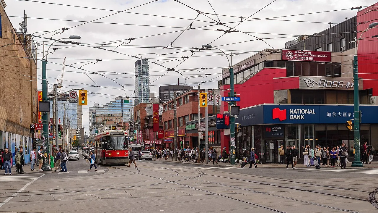 Streetcar tracks and storefronts at Dundas Street West and Spadina Avenue