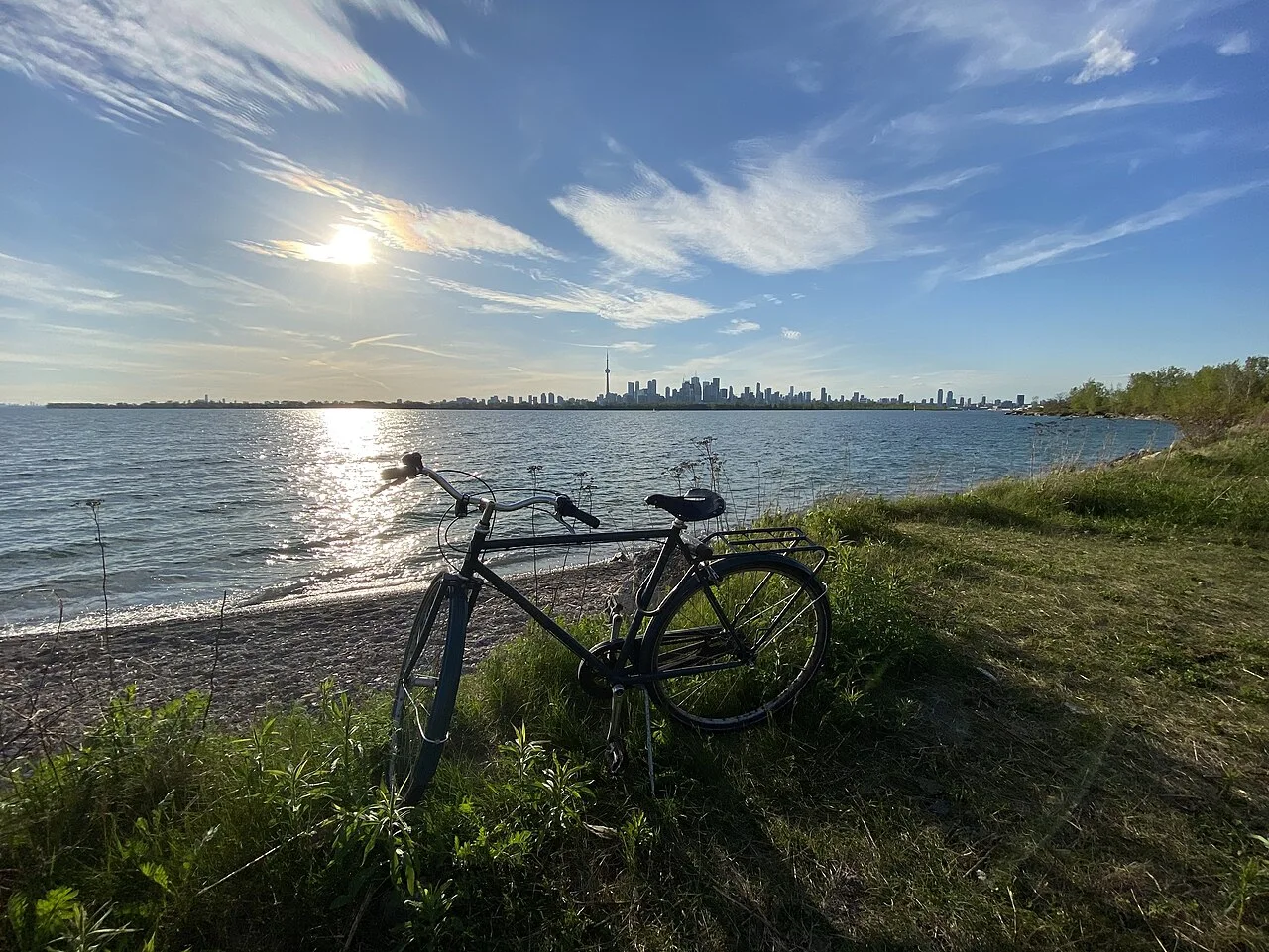 An ordinary bicycle beside Lake Ontario with Toronto’s skyline in the distance.