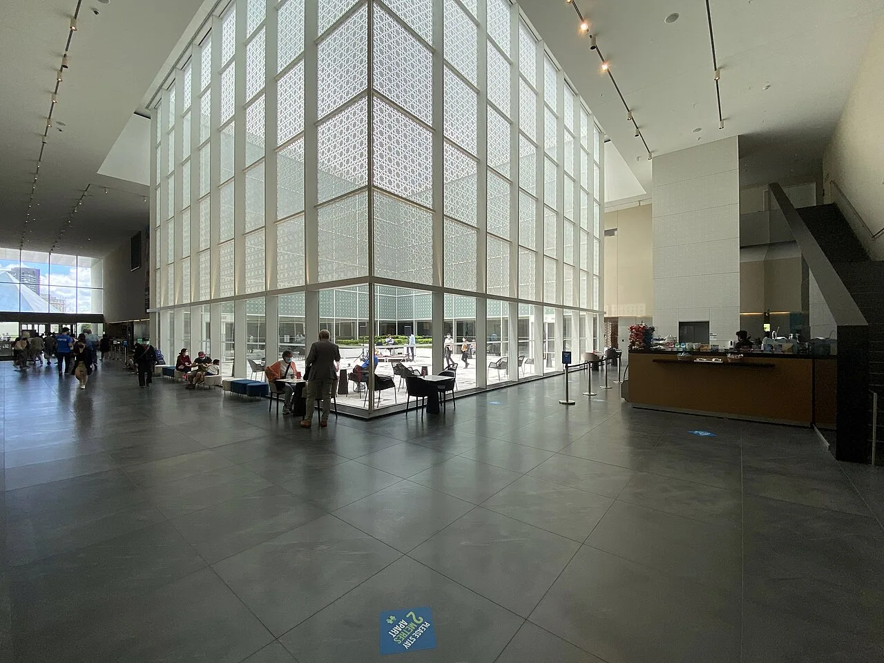 Light-filled Aga Khan Museum lobby facing the courtyard.