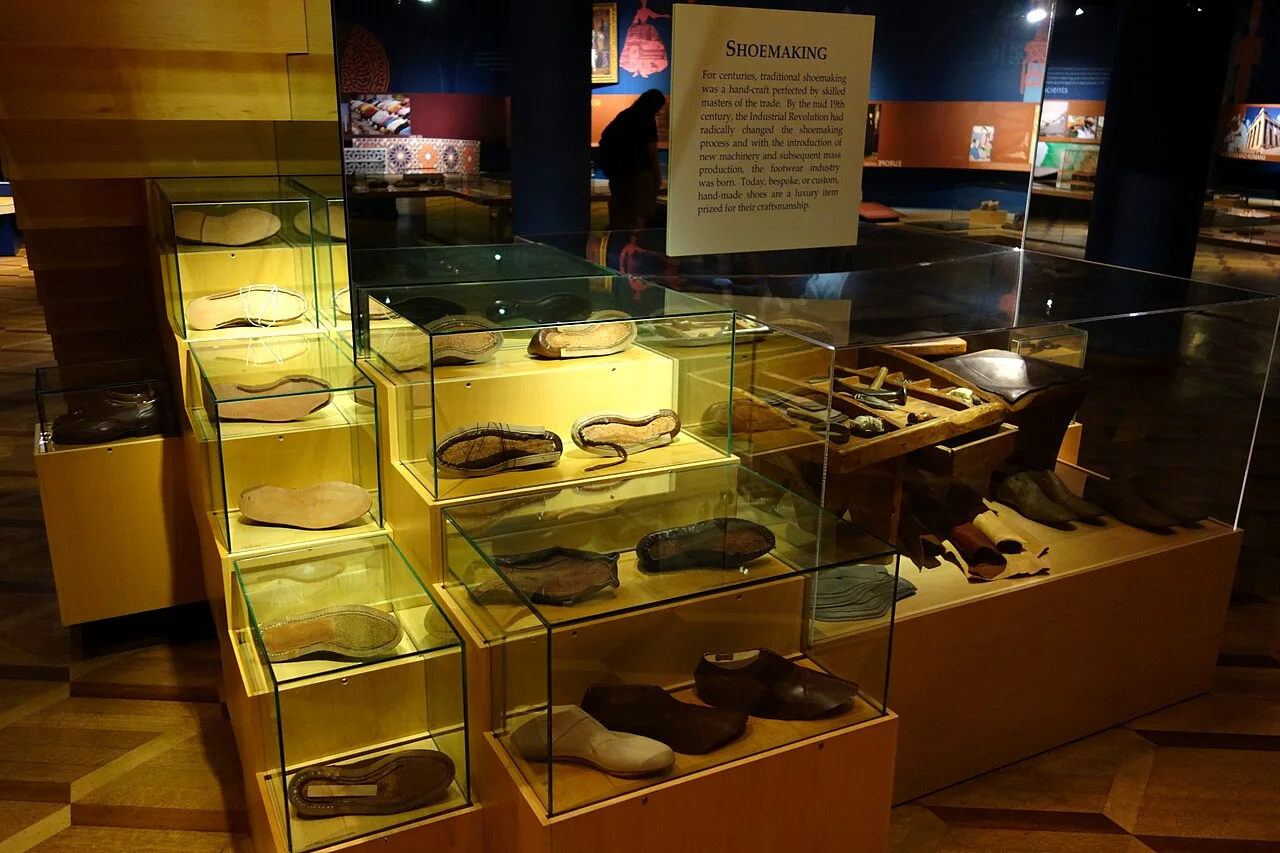 Shoemaking tools and materials in a Bata Shoe Museum display.