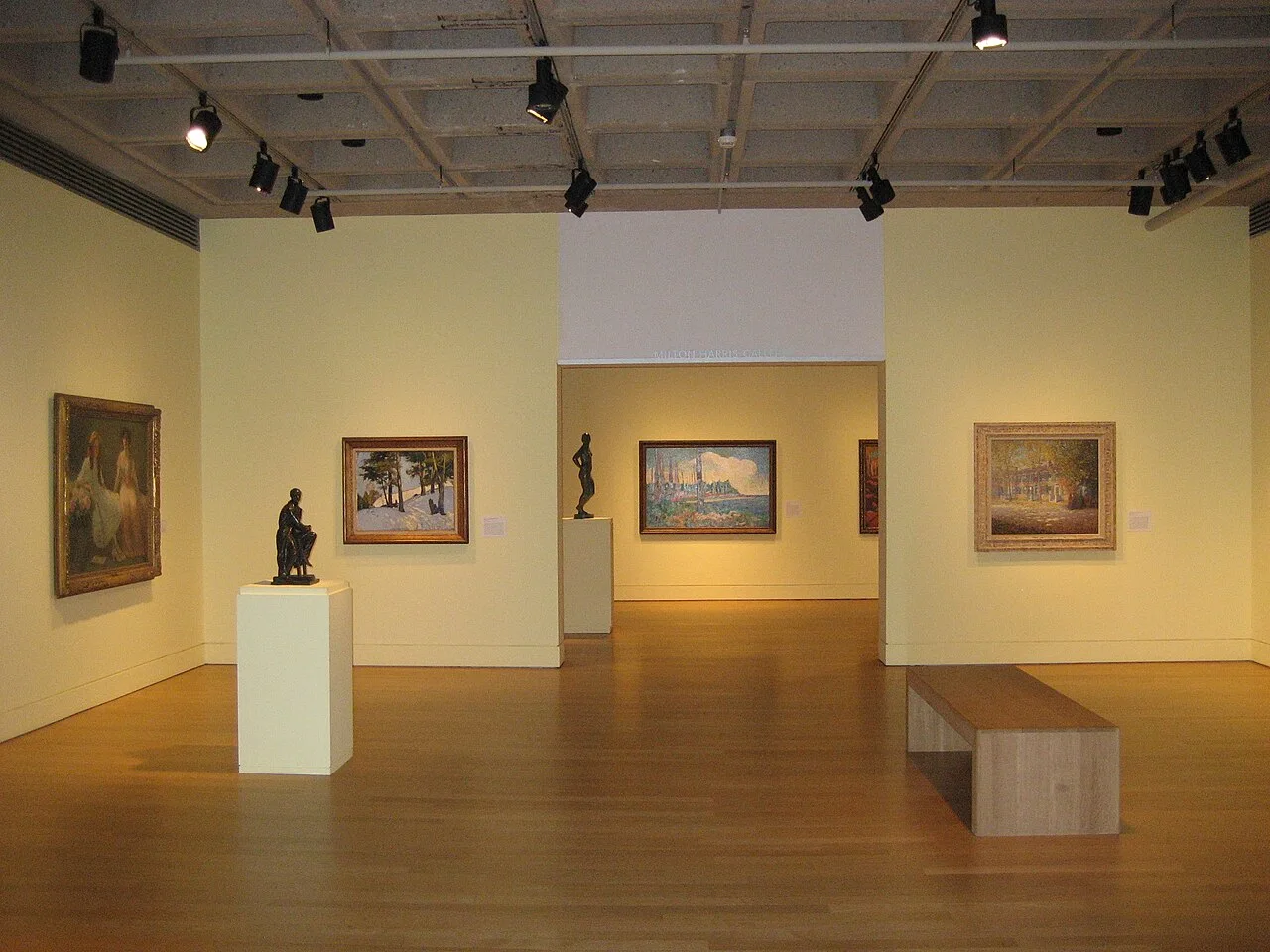 Art Gallery of Hamilton interior with paintings and sculpture across connected rooms.