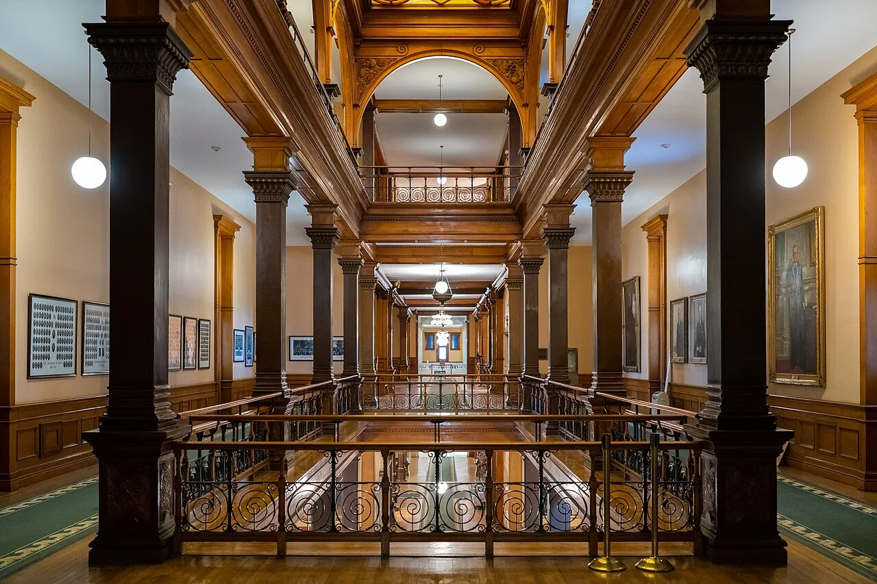 Timber columns and galleries inside the Ontario Legislative Building.