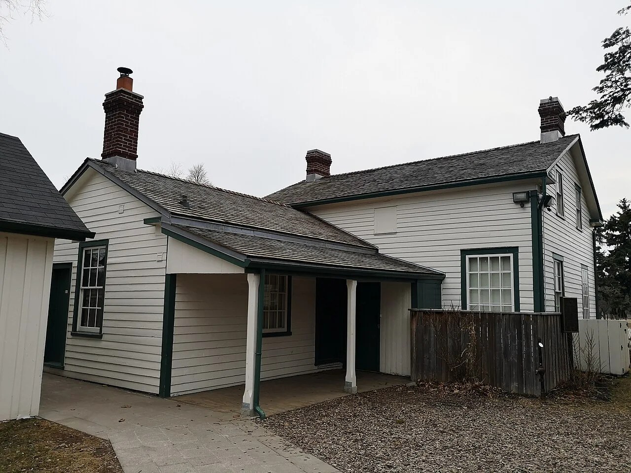 White clapboard Cornell House at Scarborough Museum.