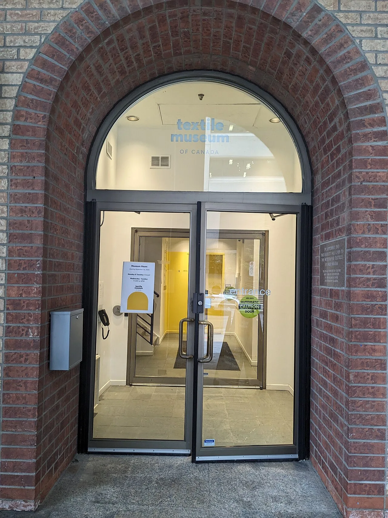 Arched entrance to the Textile Museum of Canada at 55 Centre Avenue.