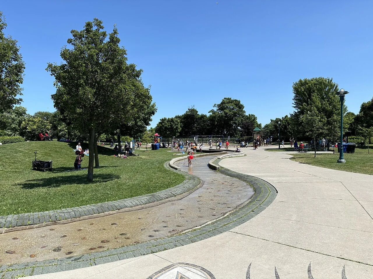 Paths, lawn and a seasonal water-play channel at Port Union Village Common