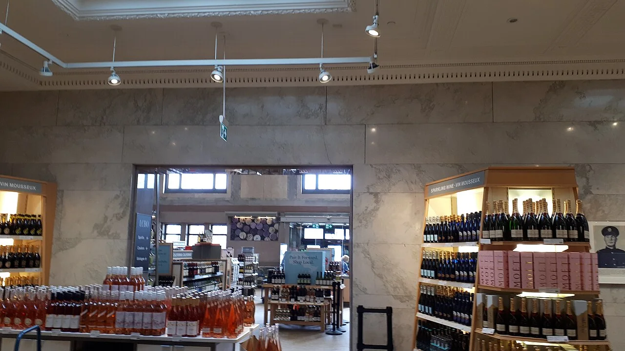 Marble walls inside the former North Toronto station with LCBO shelving