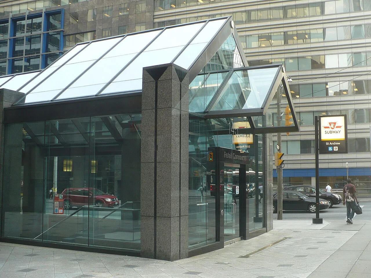 Glass elevator entrance at St Andrew subway station.