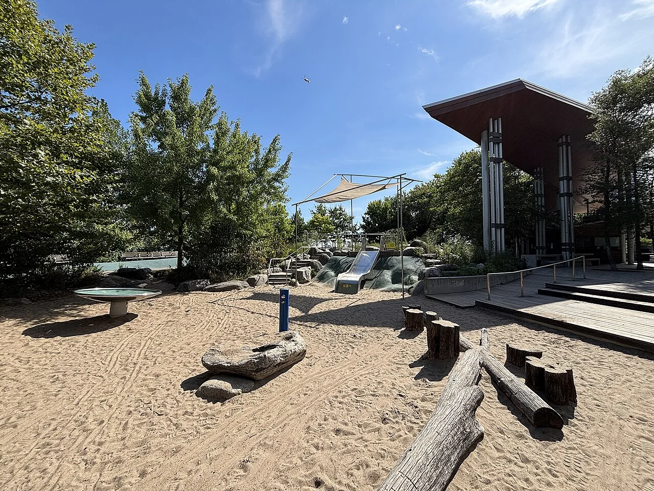 Corktown Common’s sand play area, slides, logs and pavilion.