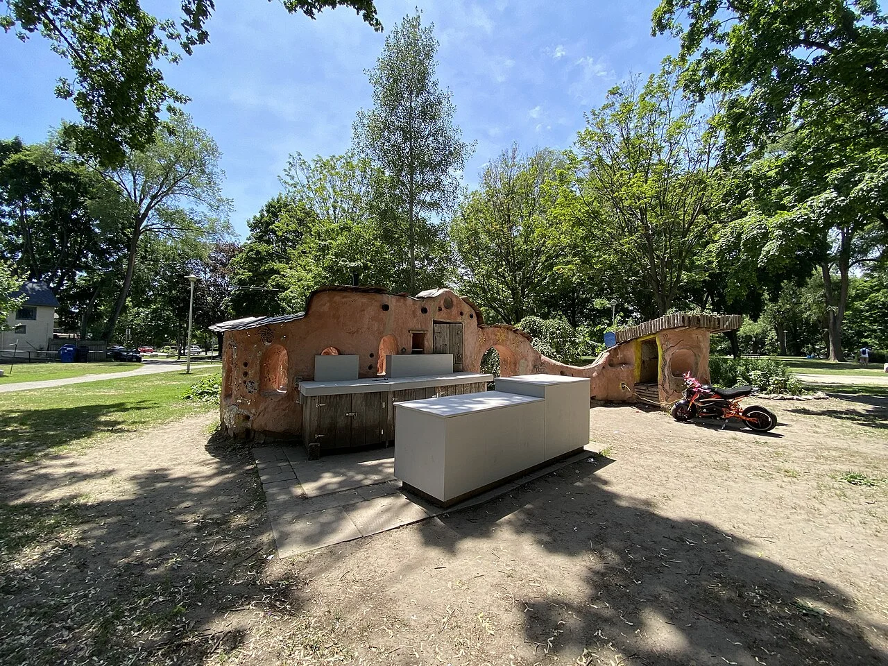 An earthen community structure near Dufferin Grove’s play area.