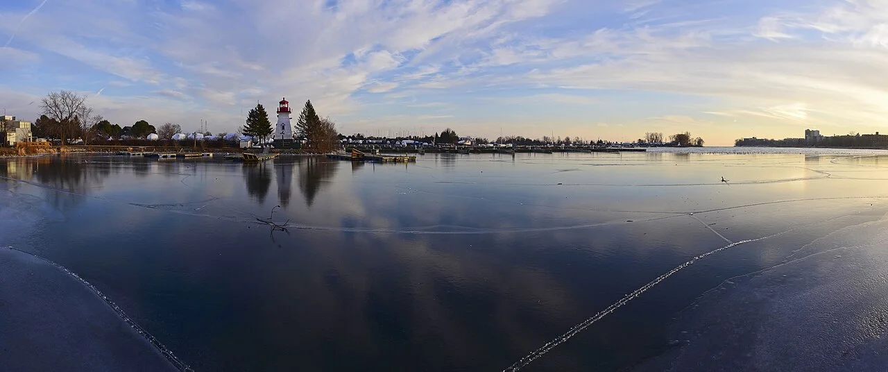 Winter ice and a lighthouse on the Humber Bay Park West shoreline.