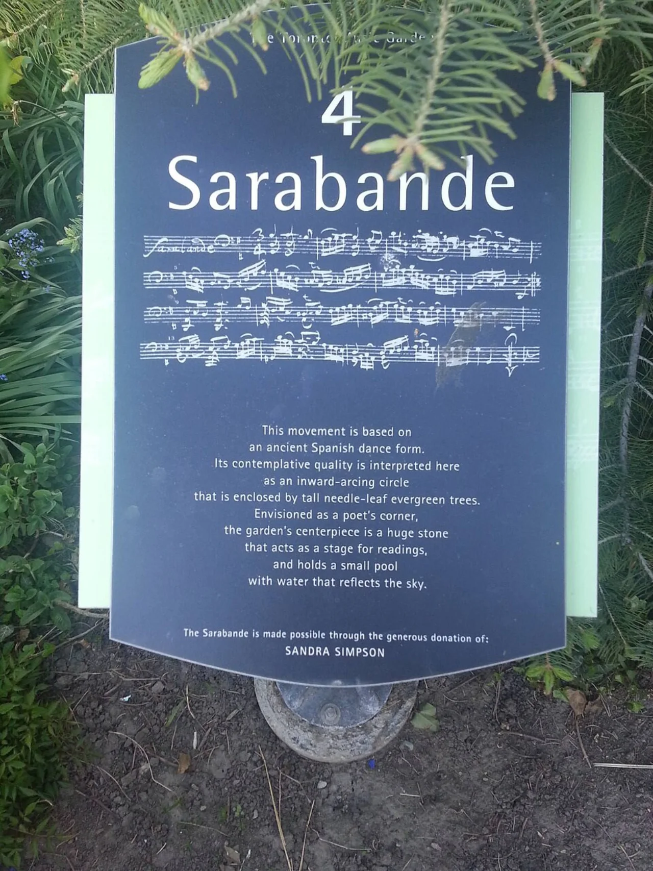An interpretive sign with a musical score identifying the Sarabande section of Toronto Music Garden.