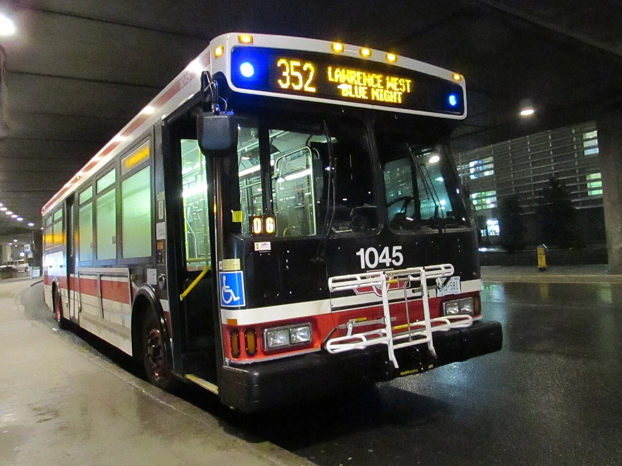 A TTC Blue Night bus at a Pearson Airport stop.