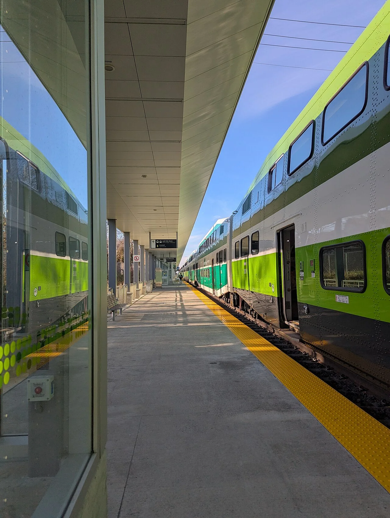 Passengers waiting on the Mount Dennis GO station platform.