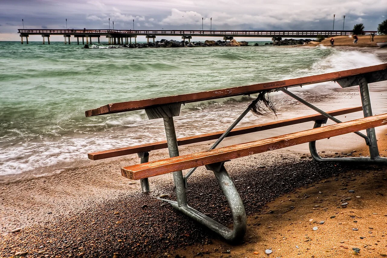 A picnic table beside the Toronto waterfront.