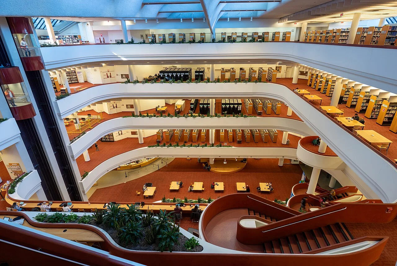 Study desks arranged beside the Toronto Reference Library atrium.