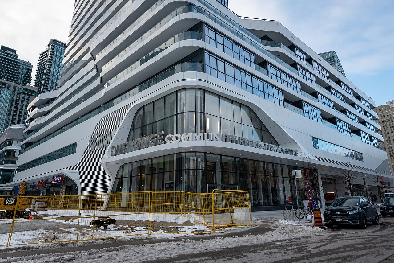 The exterior entrance of One Yonge Community Recreation Centre in winter.