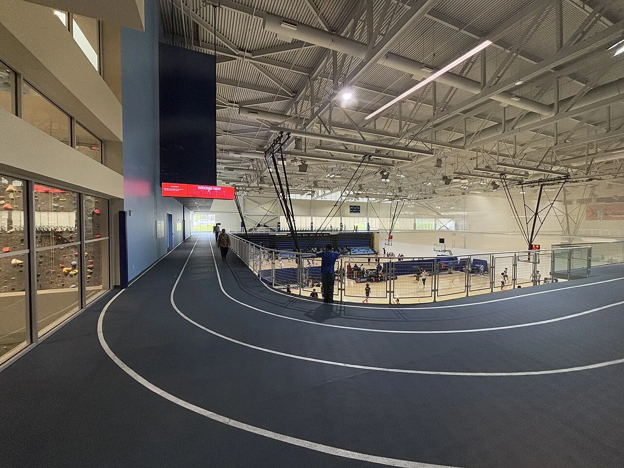 An indoor running track overlooking the sports hall at Toronto Pan Am Sports Centre.