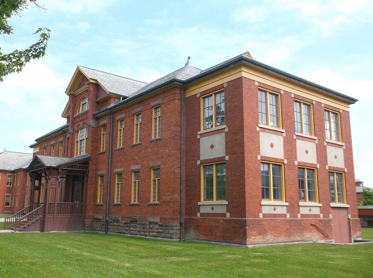 A red-brick academic building with tall windows at Humber’s Lakeshore campus.