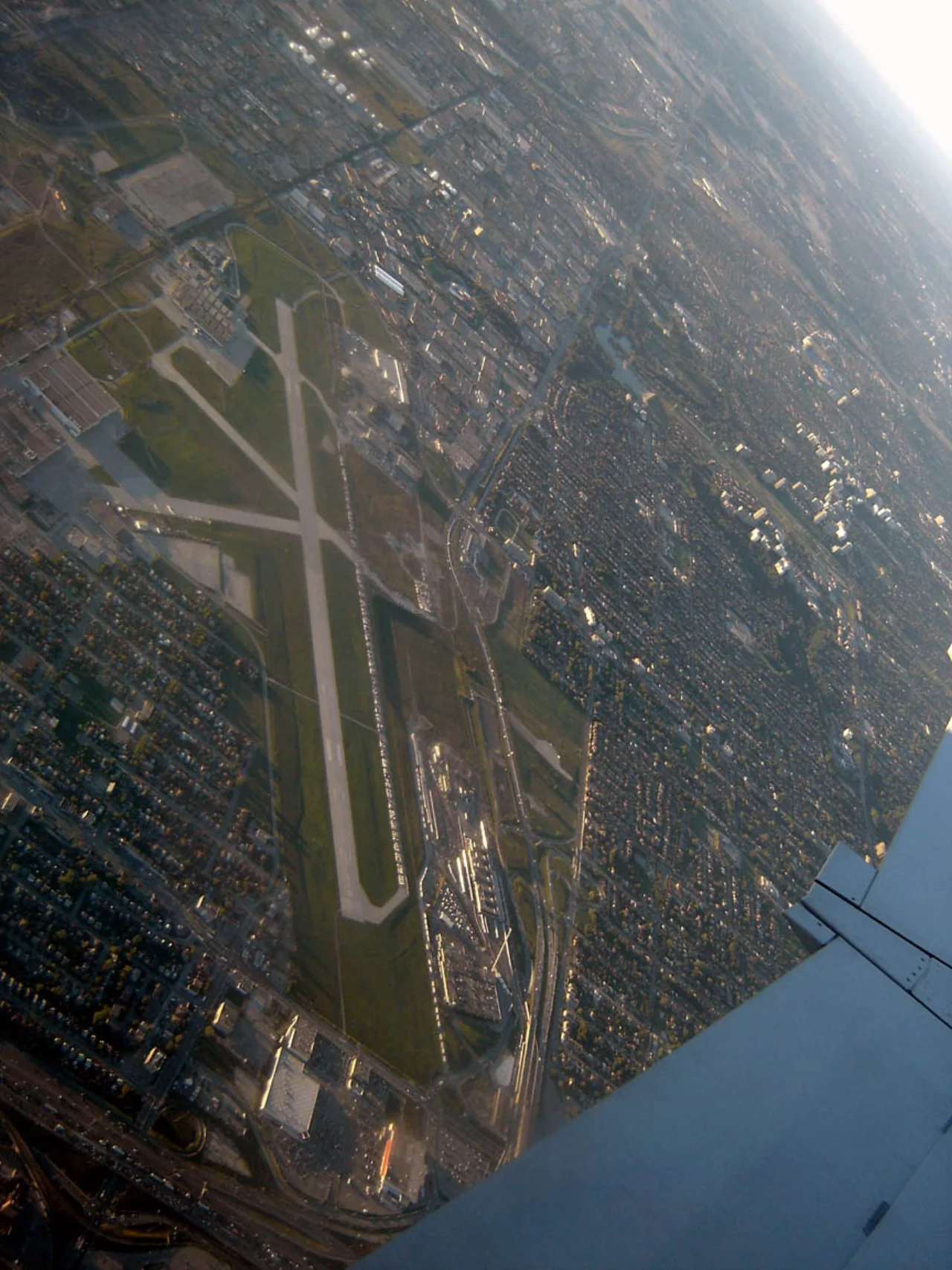 An aerial view of the former Downsview Airport runway and surrounding buildings.