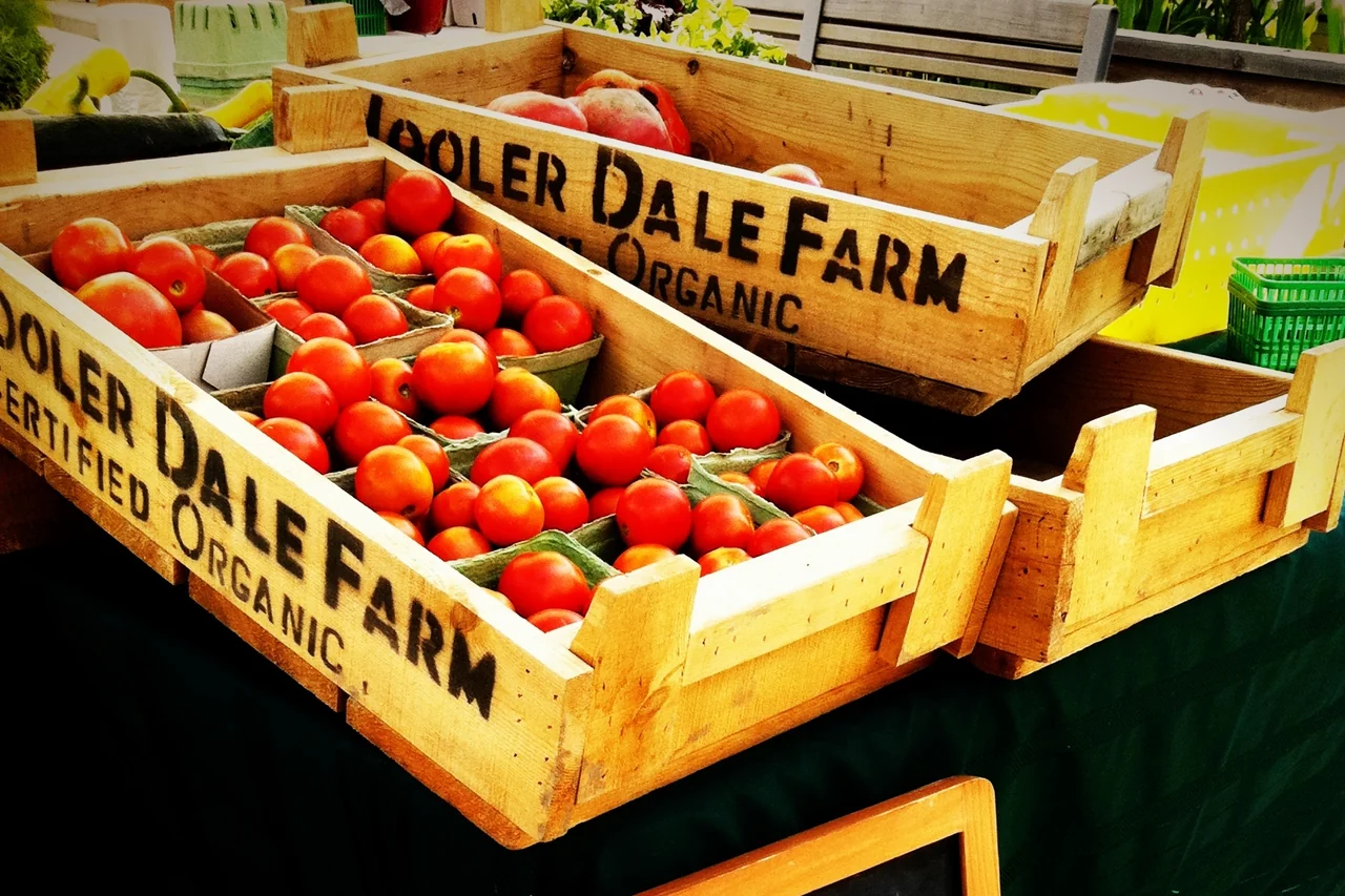 Heirloom tomatoes in wooden crates at the Wychwood Barns farmers’ market in Toronto.